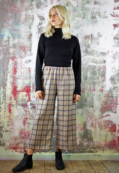 Cropped Trousers in Beige Check   Tartan crop pants, deets include:beige check fabric(with white and black)with a slightly cropped length and an exposed black elastic waist. Designed and made in our UK studio (customise the length for free) also available as a co-ord, in other colours and the fabric is available in other styles (including cargo pants and shorts) Last pic shows the blue and pink fabrics available. Relaxed Fit Plaid Pants With Elastic Waistband, Plaid Ankle-length Pants For Spring, Spring Plaid Ankle-length Pants, Plaid Trousers For Spring, Beige Cropped Leg Bottoms For Fall, Fall Beige Cropped Leg Bottoms, Plaid Relaxed Fit Straight Pants, Plaid Straight Pants With Relaxed Fit, Plaid Wide-leg Cotton Pants