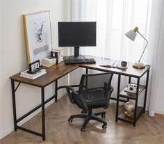 a corner desk with a computer on it