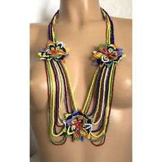 One of a Kind Native American Seed Beads Multicolor draped Flower Necklace. It Could be Navajo, Huichol or Embera tribe. Preowned in very good condition please see pictures for more details and condition  Approximately measurements 34" long Multicolor Fair Trade Beads For Festival, Multicolor Festival Beads, Multicolor Southwestern Beaded Necklace With Dangling Beads, Southwestern Multicolor Beaded Necklaces For Beach, Southwestern Style Multicolor Beaded Necklaces For Beach, Southwestern Style Multicolor Beaded Necklace For Beach, Southwestern Style Multicolor Necklaces With Dangling Beads, Southwestern Multicolor Dangling Beads, Multicolor Southwestern Style Dangling Beads