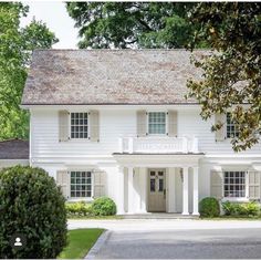 a large white house with two story windows