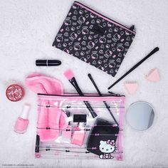 Carry Hello Kitty's favorites and your essentials with ease using the Hello Kitty® Slim Pouch set. Featuring our exclusive Hello Kitty® prints, this set is thoughtfully crafted to accommodate all your necessities on the go. Use the clear, larger pouch for bulky items and the smaller pouch for your daily makeup! Hello Kitty Prints, Vanity Hello Kitty, Impressions Vanity, Hello Kitty Images, Nest Design, Small Case, Large Pouch, Makeup Must Haves, Bow Pattern