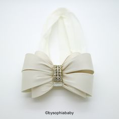 "IVORY BOW HEADBAND --->> COLORS AVAILABLE <<-- Please click here: https://www.etsy.com/shop/BySophiaBaby?ref=seller-platform-mcnav&search_query=1486 -->> FREE SHIPPING!! <<-- *BOW HEADBAND DESCRIPTION*: - Unique Handcraft Double Bow Embellished with high quality Rhinestones placed on a 2\" stretchy Headband. - Bow is made of Fabric and Rhinestones, the bow size it's approximately 3.75\"x2.75\" - This Headband is perfect for any occasion, Weddings, Flower Girls or jus Cream Headband For Baptism, Cream Baptism Headband Hair Accessory, White Matching Headband For Baptism, Cream Hair Accessories With Matching Headband For Baptism, White Hair Accessories With Matching Headband For Baptism, White Bow Headband For Wedding, Elegant White Headband For First Communion, White Adjustable Hair Accessories For Formal Occasions, Elegant White Headband With Ribbon