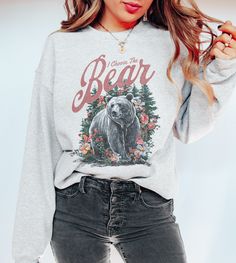 ♡ Welcome to Moxie & Bloom! Add some humor to your wardrobe with our I Choose the Bear Vintage Graphic Sweatshirt from Moxie & Bloom! This comfy Gildan 18000 sweatshirt features a vintage-inspired graphic of a bear in the forest with the cheeky phrase "I choose the bear," referencing a popular meme. With its soft, cozy feel, this meme sweatshirt is perfect for nature enthusiasts, movie lovers, and anyone with a great sense of humor. Whether you're out exploring or just lounging at home, this shi Casual Bear Print Tops For Fall, Bear Print Crew Neck Top For Fall, Fall Bear Print Crew Neck Top, Winter Cotton Top With Bear Print, Graphic Tee With Bear Print And Crew Neck, Casual Bear Print Sweatshirt For Streetwear, Winter Bear Print Cotton Top, Bear Print Crew Neck Sweatshirt For Streetwear, Bear Print Sweater