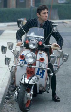 a man riding on the back of a motorcycle