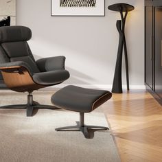 an office chair and footstool in a living room