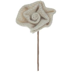 a white knitted flower on a stick