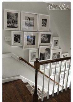 there is a staircase with pictures on the wall