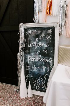 a chalkboard sign with the words welcome to penlope onederland on it