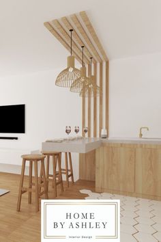 the interior of a modern kitchen with bar stools and television on the wall above it