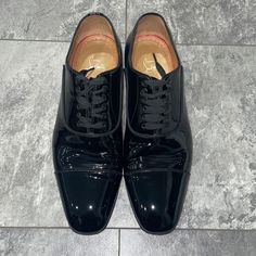 (Worn Once For A Wedding) Christian Louboutin Men’s Greggo Lace Up Shoes Flat Patent Calf Black - In Original Box - With Original Dust Bags Never Used Black Cap Toe Dress Shoes For Galas, Black Patent Leather Dress Shoes With Goodyear Welt, Designer Black Patent Leather Oxfords, Black Oxfords With Red Sole And Plain Toe, Black Plain Toe Oxfords With Red Sole, Designer Black Lace-up Oxfords, Designer Patent Leather Plain Toe Oxfords, Designer Plain Toe Patent Leather Oxfords, Formal Patent Leather Dress Shoes With Red Sole