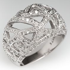 This wonderful wide band openwork ring is accented with one hundred thirty-eight (138), bead set, round brilliant cut diamonds. The ring measures 14.5mm at the top, rises 7.7mm above the finger, tapering to 3.8mm wide and 0.9mm thick at the base of the shank. This ring is currently a size 8.25. Bead Set, Wide Bands, Brilliant Diamond, Round Brilliant Cut Diamond, Cocktail Ring, High Quality Jewelry, Brilliant Cut Diamond, Cocktail Rings, Estate Jewelry