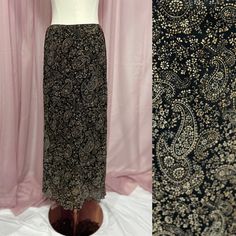 ✨ Details: Vintage 90s maxi skirt with all over whimsical black and tan paisley pattern. Stretchy waistband and all over stretchy fabric.  Fully lined. Slightly ruffled lettuce edge style hem. Straight silhouette. Brand: Emma James ✨ Sizing: Tagged size Medium (check measurements to ensure fit) Waist: 26"-30", Hips: 38"-40", Length: 34" ** Measurements reflect garment lying flat and also stretched ** ✨ Condition: Great vintage condition with no defects to note Fairy Grunge, Printed Maxi Skirts, Paisley Pattern, Paisley Print, Black And Tan, Maxi Skirt, Paisley, Womens Skirt, Halloween Shopping