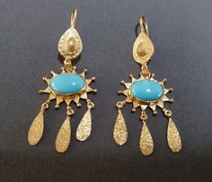 -product type - gold vermeil turquoise earring -material - silver -purity - 925 - details of 1 pair -stone - turquoise -turquoise weight - 7.80 carat -total weight - approx - 8.900 grams -silver weight - 925 - approx - 7.340 grams -turquoise size - 9 x 12 mm Elegant Turquoise Jewelry For Celebration, Turquoise Hallmarked Earrings For Gift, Elegant Turquoise Gold-plated Earrings, Handmade Gold Plated Fine Jewelry Earrings, Turquoise Gold-plated Earrings For Gifts, Artisan Gold Oval Earrings, Turquoise Fine Jewelry Earrings, Turquoise Pierced Earrings In Fine Jewelry Style, Turquoise Pierced Earrings Fine Jewelry