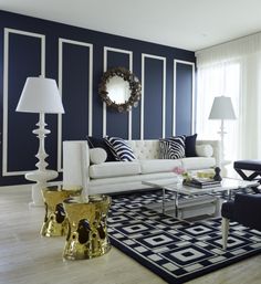 a living room with blue walls and white furniture in the center is shown on an iphone screen