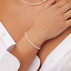 Pairing solid sterling silver beads with genuine freshwater pearls to create a classic yet contemporary look, our Beaded Seed Pearl Bracelet is a terrific addition to your bracelet stack. Made with love in our London studio, this delicate bracelet is the perfect gift for any bride or her bridesmaids.  Available in solid sterling silver and gold filled. Give your jewellery a little TLC to keep your jewellery shining bright. Your beautiful pearl bracelet will be sent to you in a complimentary Lily & Roo gift box. Made in: United Kingdom Classic Everyday Beaded Bracelets With Pearl Charm, Pearl Drop Sterling Silver Bracelet With Round Beads, Sterling Silver Bracelets With Pearl Drop And Round Beads, Everyday Silver Beaded Bracelet With Pearl Charm, Delicate Pearl Bracelet With Round Beads, Classic Polished Pearl Bracelet As A Gift, Classic Single Strand Pearl Bracelet For Everyday, Elegant Single Strand Beaded Bracelets, Classic Polished Pearl Bracelet As Gift