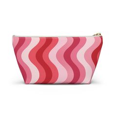 a pink and red striped cosmetic bag with zipper closures on the front, side view