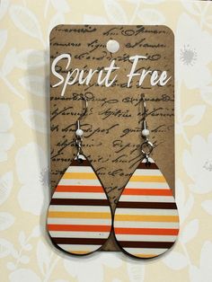 Snag these stunning earrings featuring a hand-pressed sublimation-style brown, yellow and orange striped design with stainless steel fishhook earring posts. Retro Teardrop Earrings As Gift, Orange Teardrop Earrings As Gift, Retro Brown Jewelry For Gift, Hypoallergenic Brown Drop Earrings, Fall Stripes, Striped Earrings, Fish Hook Earrings, Earring Posts, Stunning Earrings