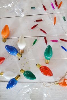 many different colored lights on a white table