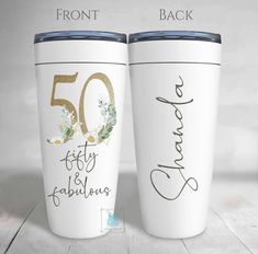 two white coffee mugs with the names fifty and fabulous written on them, side by side