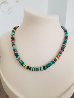 Looking for a stunning and unique accessory to complement your summer beach look? This Surfer Necklace with Colorful Heishi Beads is perfect for you! This handmade necklace features an adjustable length of 45-49 cm, allowing you to wear it at the perfect length for your neckline. The necklace is lightweight, weighing just 15 grams, making it easy to wear all day long without feeling heavy or uncomfortable. The necklace is made with colorful heishi beads and pastel African vinyl disc beads, giving it a vibrant and playful look that's perfect for a boho, beachy style. The polymer clay charm adds an extra touch of uniqueness and charm to this already stunning necklace. This necklace is a great gift for surfers, beach-goers, or anyone who loves to add a pop of color and style to their outfit. Cheap Green Necklace With Heishi Beads, Bohemian Jewelry With Letter Beads For Beach Season, Colorful Heishi Beads Beach Jewelry, Beachy Jewelry With Colorful Heishi Beads, Colorful Beaded Jewelry For Vacation, Summer Vacation Jewelry With Spacer Beads, Handmade Heishi Beads Necklaces For Beach, Vacation Heishi Beaded Necklaces, Colorful Round Beads Beach Necklace