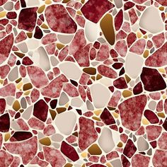 a red and white mosaic tile pattern with gold foil on it's edges,