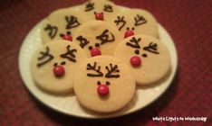 decorated cookies with chinese writing on a plate