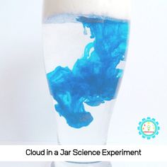 blue liquid in a glass with the words cloud in a jar science experiment on it