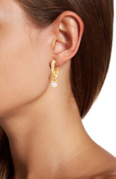 A pavé huggie earring is elongated with the elegant addition of a prong set CZ drop that for a polished and sophisticated look. 0.75" length Hinged post back 14k yellow gold plated sterling silver, cubic zirconia Imported Party Huggie Dangle Earrings, Teardrop Prong-set Huggie Earrings, Teardrop Huggie Earrings With Prong Setting, Earrings Sparkle, Huggie Earring, Sparkle Earrings, Natural Style, Quartz Stone, Huggies Earrings