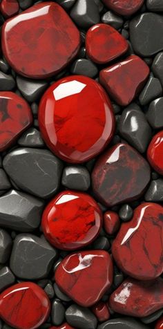 red and black rocks are arranged together in the shape of heart - shaped shapes, as if they were floating on water