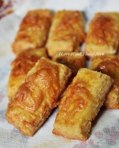 several pieces of pastry sitting on top of a table