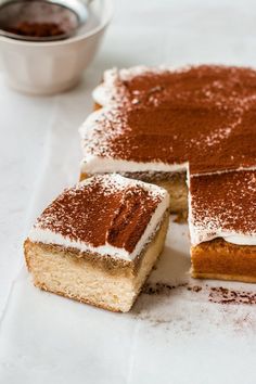 This easy tiramisu cake is made of a tender vanilla cake soaked with coffee syrup, topped with creamy mascarpone frosting, and dusted with cocoa powder. Just like classic tiramisu in cake form! | how to make tiramisu cake | homemade tiramisu cake | tiramisu cake recipe | tiramisu cake dessert | tiramisu dessert recipes | tiramisu dessert ideas | cake flavor ideas | cake recipes Coffee Simple Syrup, Tiramisu Cake Recipe, Sheet Cake Recipe, Mascarpone Frosting, Cocoa Cake, Tiramisu Cake, Tiramisu Recipe, Food Cakes, Sheet Cake