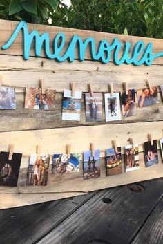 a wooden sign with photos hanging from it's sides and the word memories written in blue