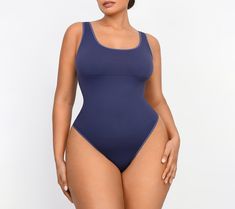 Featuring a low-back design that pairs perfectly with backless dresses, this smoothing bodysuit also features chest support and smoothing at the tummy to provide a lifted and flattering appearance. From Shapellx. Contoured Seamless Bodysuit Shapewear, High Stretch Smoothing One-piece Bodysuit, Smoothing Contoured Bodysuit, Solid One-piece Smoothing Leotard, Smoothing One-piece Leotard, Seamless Contoured Shapewear Bodysuit, Solid Color Smoothing Shapewear Bodysuit, Contoured Seamless Shapewear Bodysuit, One-piece Second-skin Smoothing Bodysuit