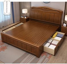 a bed with drawers underneath it in a bedroom