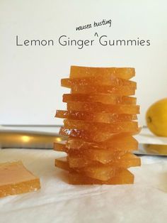 a stack of lemon ginger gummies sitting on top of a table next to a knife