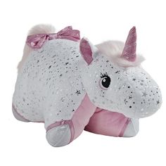 a stuffed animal with pink and white sequins on it's head, laying down