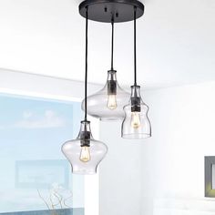 three lights hanging from a ceiling in a room