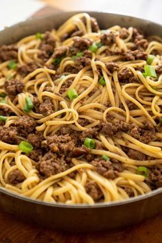 a skillet filled with noodles and ground beef is the perfect meal for busy nights