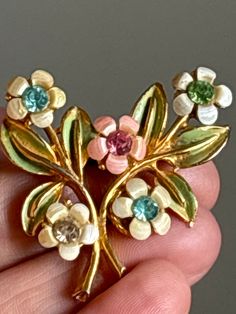 Vintage gold tone brooch , hook clasp , with enamel and crystal flowers . Possibly Czech Flower Shaped Costume Jewelry Brooch, Collectible Gold Flower Enamel Pin, Gold Enamel Costume Jewelry Brooches, Crystal Flowers, Jewelry Board, Jewelry Boards, Crystal Brooch, Hook Clasp, Vintage Antique Jewelry