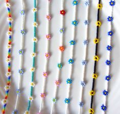 several beads are arranged on a white plate