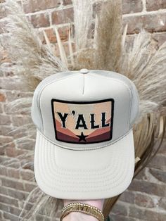 "Be the trendsetter in our Y'all Trucker Hat! This best selling hat is not only trendy and cute, but also features an adjustable clip for the perfect fit. Get ready to rock this hat wherever you go!" Available in 2 colors! Trendy Trucker Hats, Sublimation Shirts, Hat Bar, Hat Jewelry, Custom Trucker Hats, Western Life, Sublime Shirt, Custom Hats, Casual Street Style