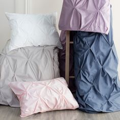 three pillows stacked on top of each other