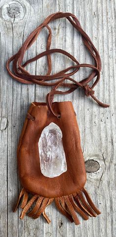 Soft brown medicine pouch/healing stone and crystal necklace pouchyou can carry your healing stone with you every day..either around your neck or in your bagthe pouch measures 3 inches tall without the fringes...the leather lace measures 44 inches long in total, 22 inches half way the crystal point is 2 inches tall and a little over 3/4 inches wide.... Crystal Pouch Necklace Diy, Medicine Pouch Diy, Diy Medicine Pouch Necklace, Medicine Pouch Pattern, Medicine Bag Necklace, Leather Medicine Pouch, Medicine Pouch, Native American Clothing, Medicine Bag