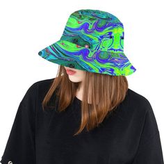 These Colorful Boho Hippie Bucket Hats feature a Groovy Abstract Retro Green and Blue Swirl Original All Over Print Design. It will keep the Sun off your face and give you a cool vibe at the same time! The Unisex construction make it perfect for Women, Men, Teens and Tweens. Made from Chino Cotton Twill – these bucket hats are soft, slightly shiny, comfortable, and fun! This Original Digital Oil Painting by My Rubio Garden features a Groovy Abstract Retro Lime Green and Blue Liquid Art Swirl Pai Trendy Green Festival Hat, Trendy Green Hat For Festivals, Trendy Green Hat For Festival, Adjustable Funky Bucket Hat, Casual Green Bucket Hat For Festivals, Adjustable Green Bucket Hat For Festivals, Funky Green Adjustable Hat, Adjustable Funky Green Hat, Blue And Magenta