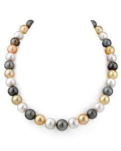 This gorgeous necklace is a recent addition to our massive collection of multicolor pearl masterpieces. The pearl necklace includes gorgeous 10-11mm pearls in AAA quality with an 'high' grade luster. The colors in this necklace are truly amazing, including a wide variety of White, Tahitian, and Golden South Sea pearls. Included with this item is a complementary pearl polishing cloth, giving you the ability to maintain this necklace’s elegant beauty for years to come. Multicolor Pearl Necklace, Tahitian Pearl Necklace, Golden South Sea Pearls, 14k Yellow Gold Necklace, Jewelry Style, Beading Projects, Black Jewelry, Sea Pearls, South Sea Pearls