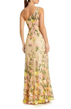 Bring the garden to the party in this enchanting dress designed in a one-shoulder silhouette and covered in a bounty of blooms. 61" length Hidden back-zip closure One-shoulder neck Lined 100% polyester Spot clean Imported Asian Owned/Founded Spring Evening Gown With Floral Applique, Spring Gala Gown With Floral Applique, Spring Floor-length Evening Dress With Floral Applique, Spring Floral Embroidered Maxi Evening Dress, Spring Floral Applique Floor-length Evening Dress, Spring Floral Embellished Floor-length Evening Dress, Spring Evening Gown With Floral Embroidery, Spring Floor-length Evening Dress With Floral Embroidery, Spring Floral Print Gala Gown