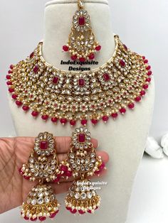 Elegant Kundan necklace set comes with beautiful jhumki earrings and tikka/Hot pink/Magenta Kundan Necklace/Kundan Polki Necklace/Reception/Wedding/bridal jewelry/ Indian jewelry/Kundan Jewelry All items are shipped from Brampton, Ontario, Canada. If you need your item by a certain day, please reach out to us for express delivery option. We kindly request to consider minor variations in colors, shades, textures as pictures displayed may slightly vary from the actual product due to digital image limitations.Please expect the possibility of some minor imperfections when buying handmade jewelry. Please contact us for any questions you might have. Thank you and Happy shopping 😊 Pink Kundan Jewelry Sets, Pink Round Kundan Necklace For Diwali, Heavy Pink Jewelry Sets For Festivals, Heavy Pink Kundan Chandbali Necklace, Heavy Pink Kundan Jewelry Sets, Heavy Pink Chandbali Kundan Necklace, Heavy Pink Bollywood Jewelry Sets, Pink Kundan Necklace, Kundan Polki Necklace