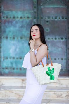 Discover the perfect blend of style and functionality with our Green Cactus-Inspired Straw Tote Bag. This trendy woven basket, measuring a chic 46 x 25 x 20 cm, features a unique cactus design, adding a touch of desert charm to your ensemble. Unveil the beauty within as you open the bag, revealing a meticulously lined interior in a coordinating shade. The luxurious lining enhances both the durability and aesthetics of the bag, ensuring a polished and organized look. For added convenience and security, our tote is equipped with a practical zip closure. Open and close your bag effortlessly, providing ease of access while keeping your belongings safe. Whether you're heading to the beach, a weekend getaway, or a casual day out, this Green Cactus Straw Tote Bag is the perfect companion, offerin Cactus Motif, Straw Tote Bag, Green Cactus, Cactus Design, Straw Tote, Woven Basket, Functional Accessories, Tote Purse, Fashion Games