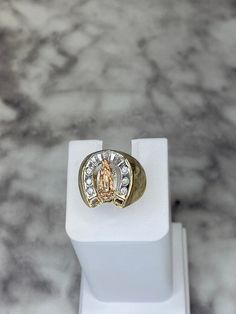 -14K Lady of Guadalupe ring -18.5x16mm Top dimensions -4mm Bottom band thickness -Rose gold lady of Guadalupe Body -White gold horseshoe W/CZ embedded -Size 10 (sizing upon request) 14k Gold Horseshoe Ring, Gold Our Lady Of Guadalupe Ring For Anniversary, Quinceanera Rings, Lady Of Guadalupe, Ring Collection, Ring Collections, Name Necklace, Rings Statement, Gold Bands