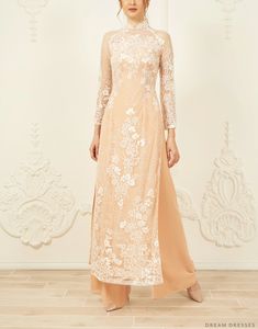 Lace Bridal Ao Dai | Traditional Vietnamese Bridal Dress | Dream Dresses by P.M.N. Champagne Ao Dai, Elegant Pink Ao Dai With Floral Embroidery, Beige Wedding Dress With Intricate Embroidery, Intricate Embroidery Ao Dai For Wedding, Elegant Ao Dai With Intricate Embroidery For Ceremony, Pink Elegant Wedding Dress For Ceremony, Elegant Pink Wedding Dress For Ceremony, Elegant Floral Embroidered Maxi Dress For Wedding, Wedding Maxi Dress With Floral Embroidery And Fitted Bodice